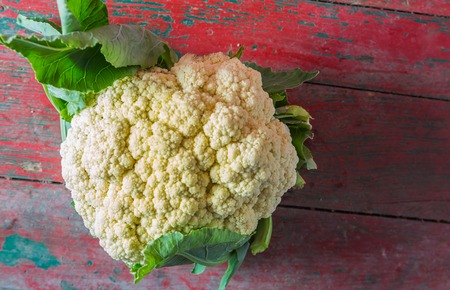 Fresh organic cauliflower on old wooden backgroundの写真素材