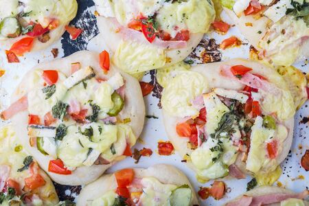 Mini pizza appetizers homemade on a baking trayの写真素材