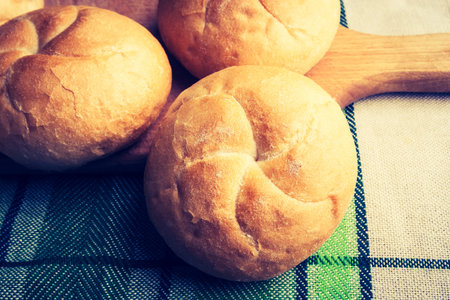 Vintage photo of fresh rolls on table
