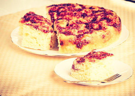 Vintage photo of yeast cake with raspberry jam