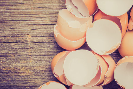 Vintage photo of eggshell on the wooden table
