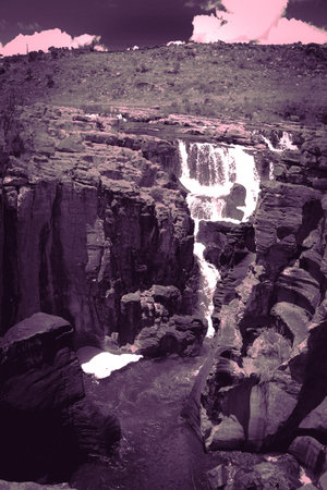 Waterfall in the mountains, closeup of photo, horizontal aspect