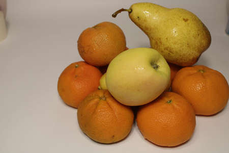 Fruits. Tangerines, pear, apple.の写真素材