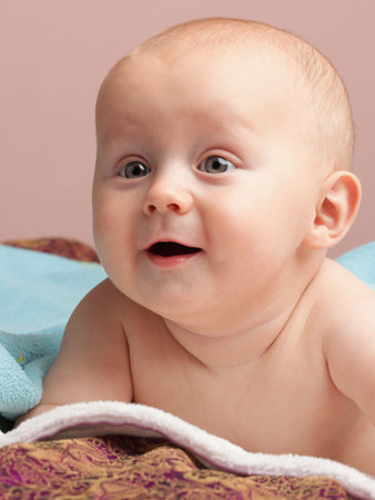 portrait of 6 months male child baby boy in blue eye