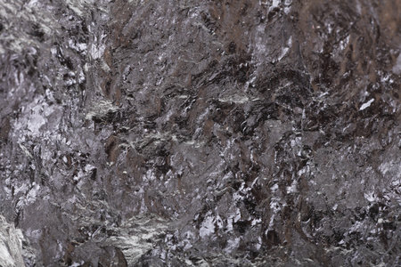 Pieces of black fossil coal texture background