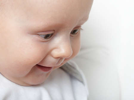 portrait of 6 months male child baby boy in blue eyeの写真素材