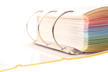 file folder with documents and papers isolated on whiteの写真素材