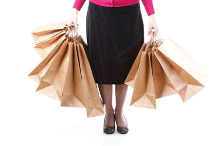Shopping brown recycle gift bags in woman hand isolated white backgroundの写真素材