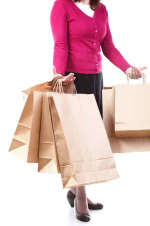 Shopping brown recycle gift bags in woman hand isolated white backgroundの写真素材