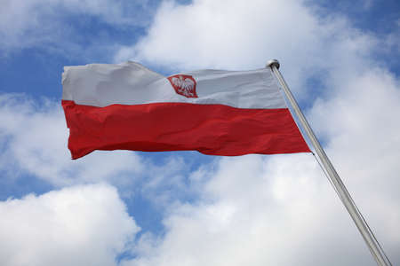Flag of Poland on blue sky outdoorの写真素材