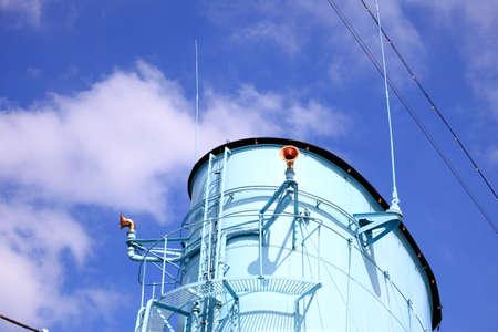 Funnel and whistle from a steamship against a grey skyの写真素材