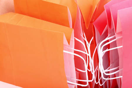 Shopping orange gift bags nobody color backgroundの写真素材