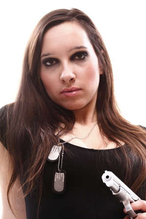 Sexy young woman in red with a gun isolated on whiteの写真素材