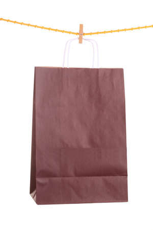 Shopping brown gift bags isolated on white backgroundの写真素材