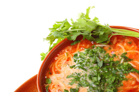 Tomato soup parsley isolated against a white backgroundの写真素材