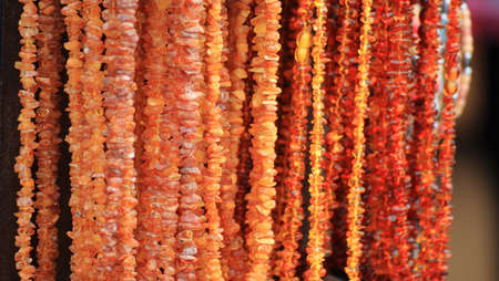 Stones of amber and a necklace backgroundの写真素材
