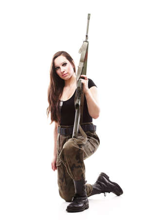Beautiful woman with rifle plastic Military Army girl Holding Gun white isolated backgroundの写真素材