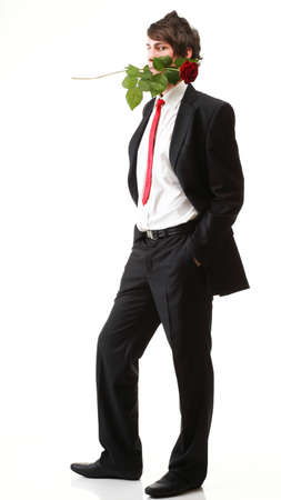 Young handsome man with flower, red rose isolated white backgroundの写真素材