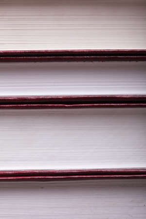 books on book shelf background stack red book library objectの写真素材