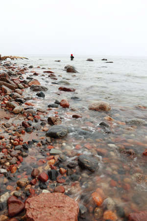 Fisherman Stones in sea water autumn in Orlowo, Gdynia Polandの写真素材