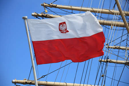 Flag of Poland on blue sky ship outdoorの写真素材