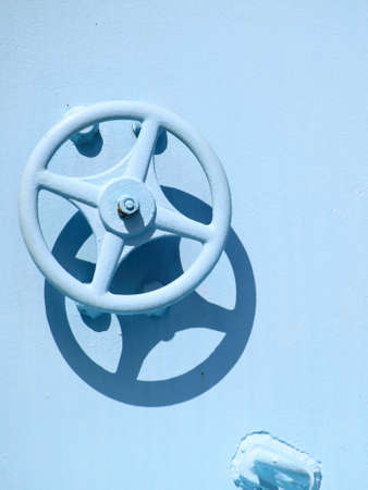 industrial faucet wheel on blue background, nobodyの写真素材