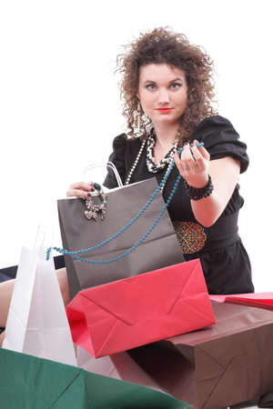 lovely woman with shopping bags over whiteの写真素材