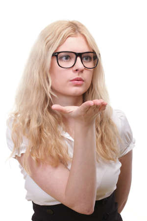 beautiful young blonde woman blowing a kissの写真素材