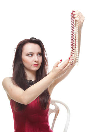 entertainment pastime girl dance in red corset chair white isolated showgirl jeweleryの写真素材