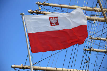 Flag of Poland on blue sky ship outdoorの写真素材