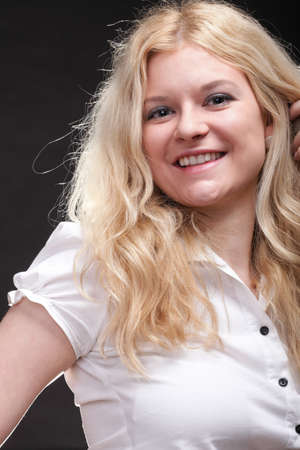 portrait of beautiful blonde woman black backgroundの写真素材