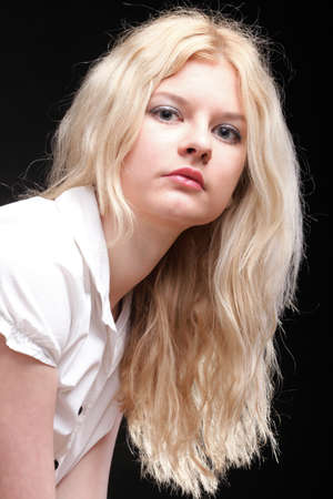 portrait of beautiful blonde woman black backgroundの写真素材