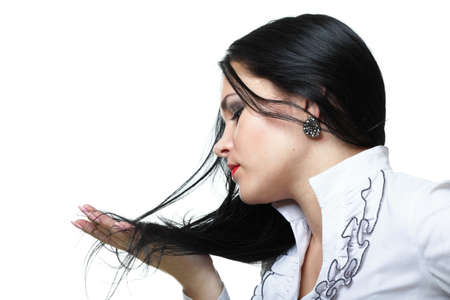 beautiful woman with long hair posing isolated on whiteの写真素材