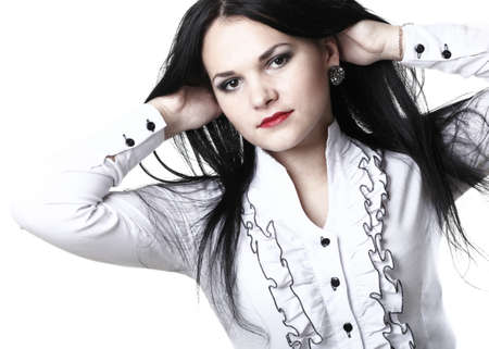 beautiful woman with long hair posing isolated on whiteの写真素材