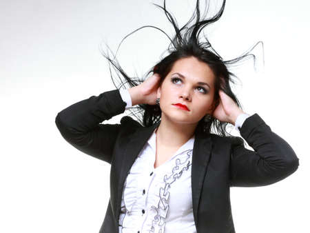 beautiful woman with long hair posing isolated on whiteの写真素材