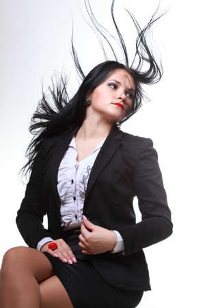 beautiful woman with long hair posing isolated on whiteの写真素材