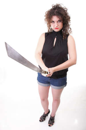 Girl - woman dark curly hair natural brown-haired holding hands katana swordの写真素材
