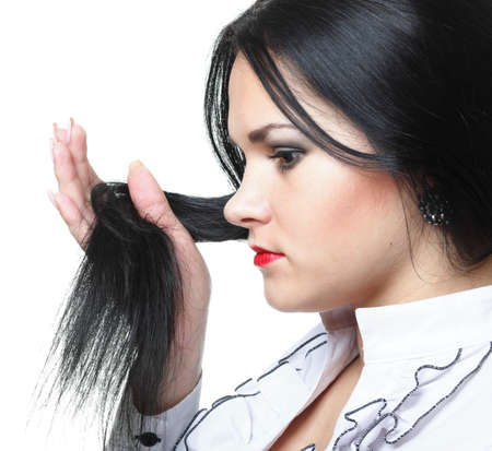 beautiful woman with long hair posing isolated on whiteの写真素材