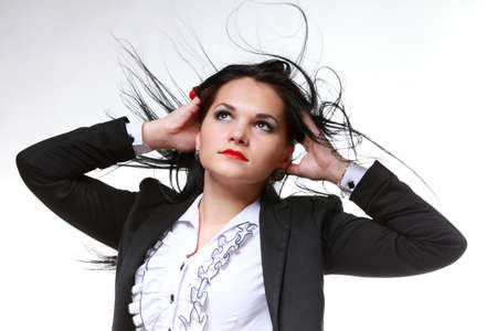 beautiful woman with long hair posing isolated on whiteの写真素材