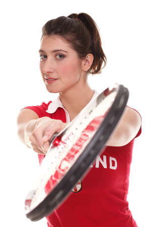 Full isolated studio picture from a young woman with tennis racketの写真素材