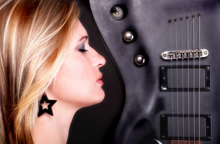 Sexy profil face girl and Guitar Woman blondeの写真素材