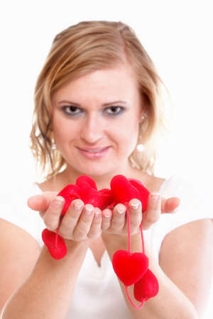Heart symbol in woman hands isolated on whiteの写真素材