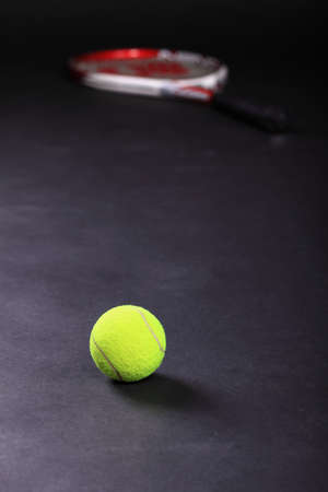 tennis racket and balls on black background studio shotの写真素材