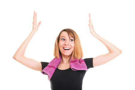 Fitness woman jumping excited isolated on white background image of beautiful multiracial Caucasian...