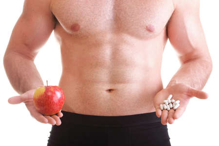 natural apple vitamin or pill drag tablet Man isolated offering pill in one and pills in bottle - in another hand. Copy space boxes with supplementsの写真素材