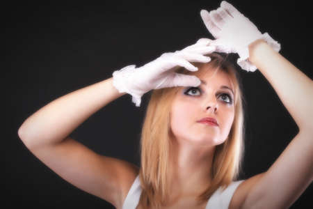 picture of beautiful woman in white gloves black backgroundの写真素材