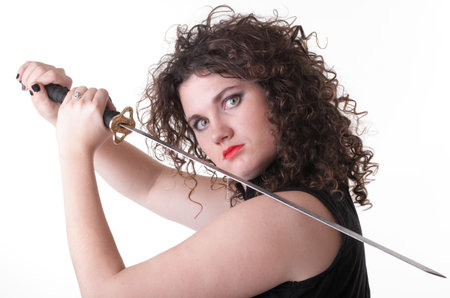 Girl - woman dark curly hair natural brown-haired holding hands katana sword