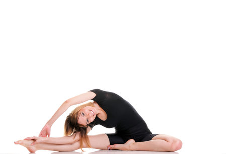 Sport Young woman in black doing exercise gymnastic pose isolated on white