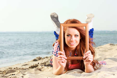 Woman sea sky vacation Holding Frame travel conceptの写真素材