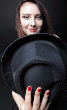 Portrait woman in red corset showgirl black backgroundの写真素材